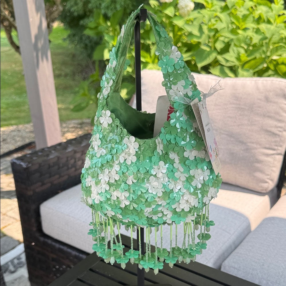 Beaded clover, green, and white handbag crafted in India